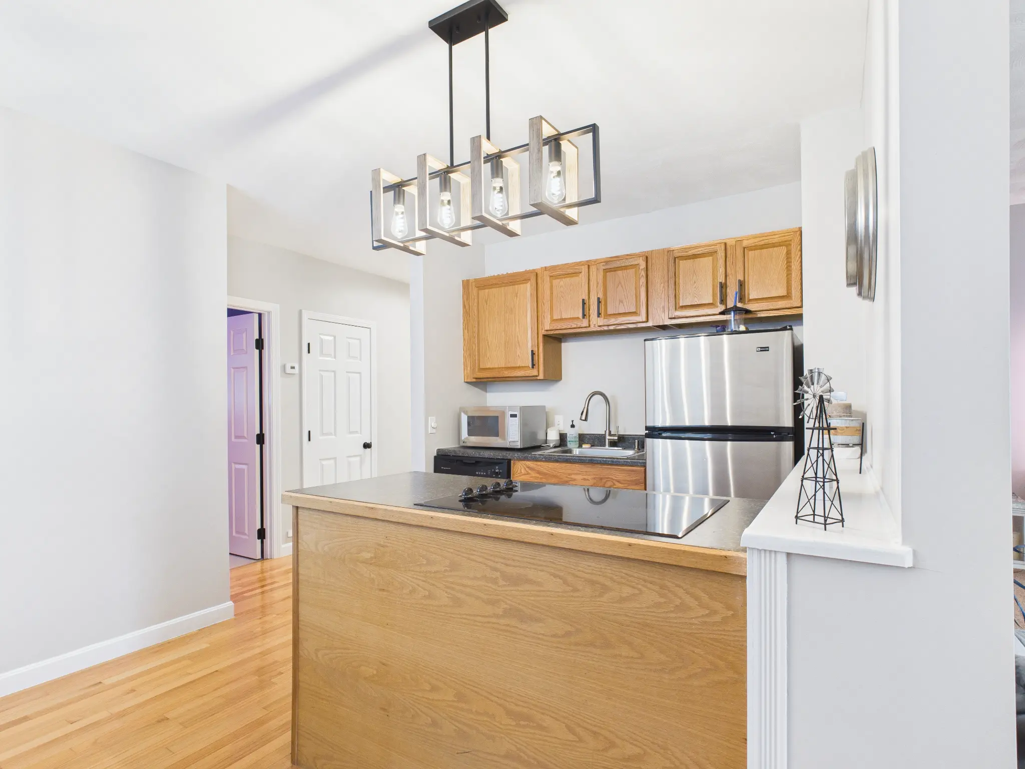 Lower-level kitchen and eating area real estate photo sample