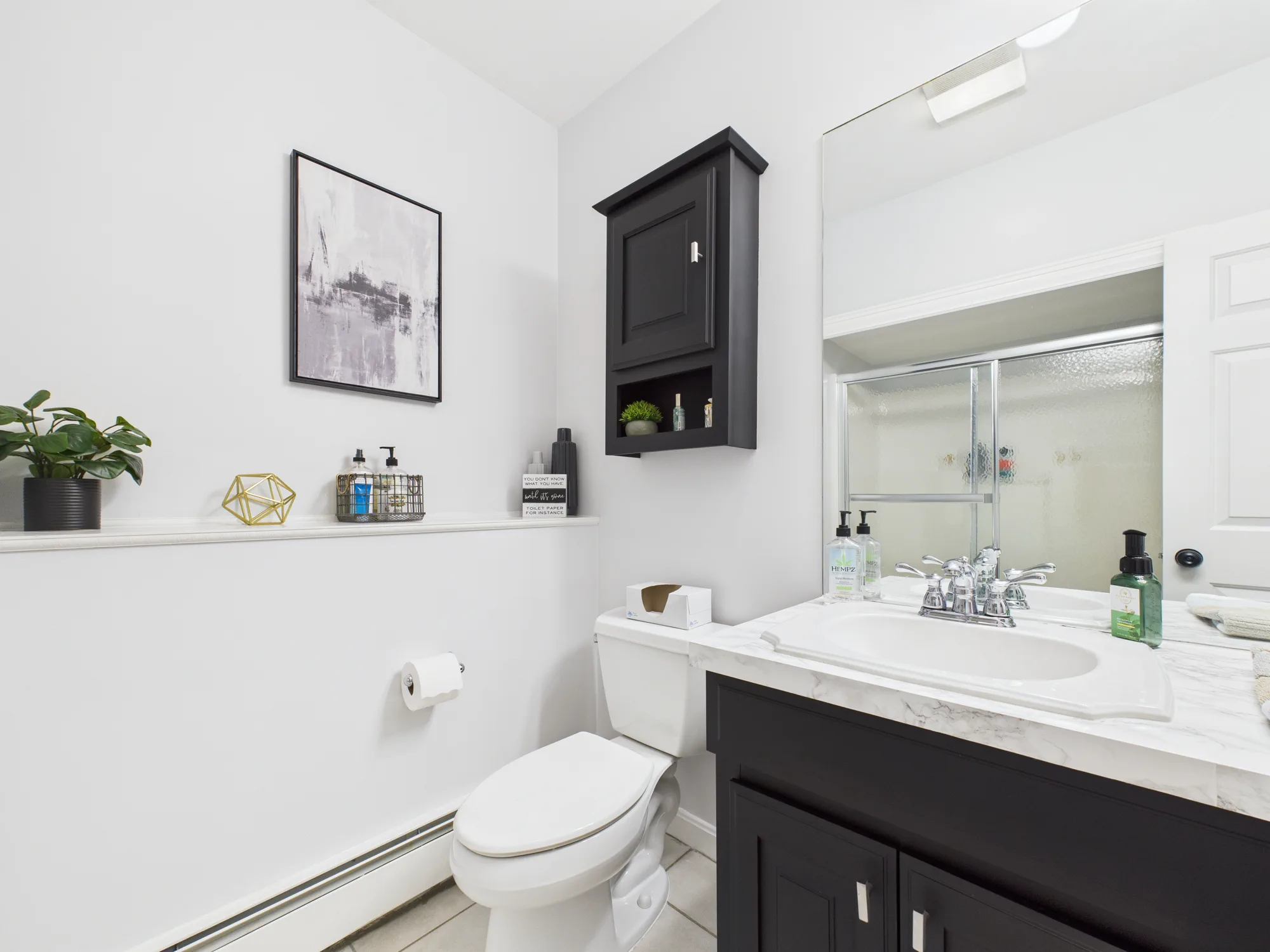 Lower-level shower and vanity real estate photo sample