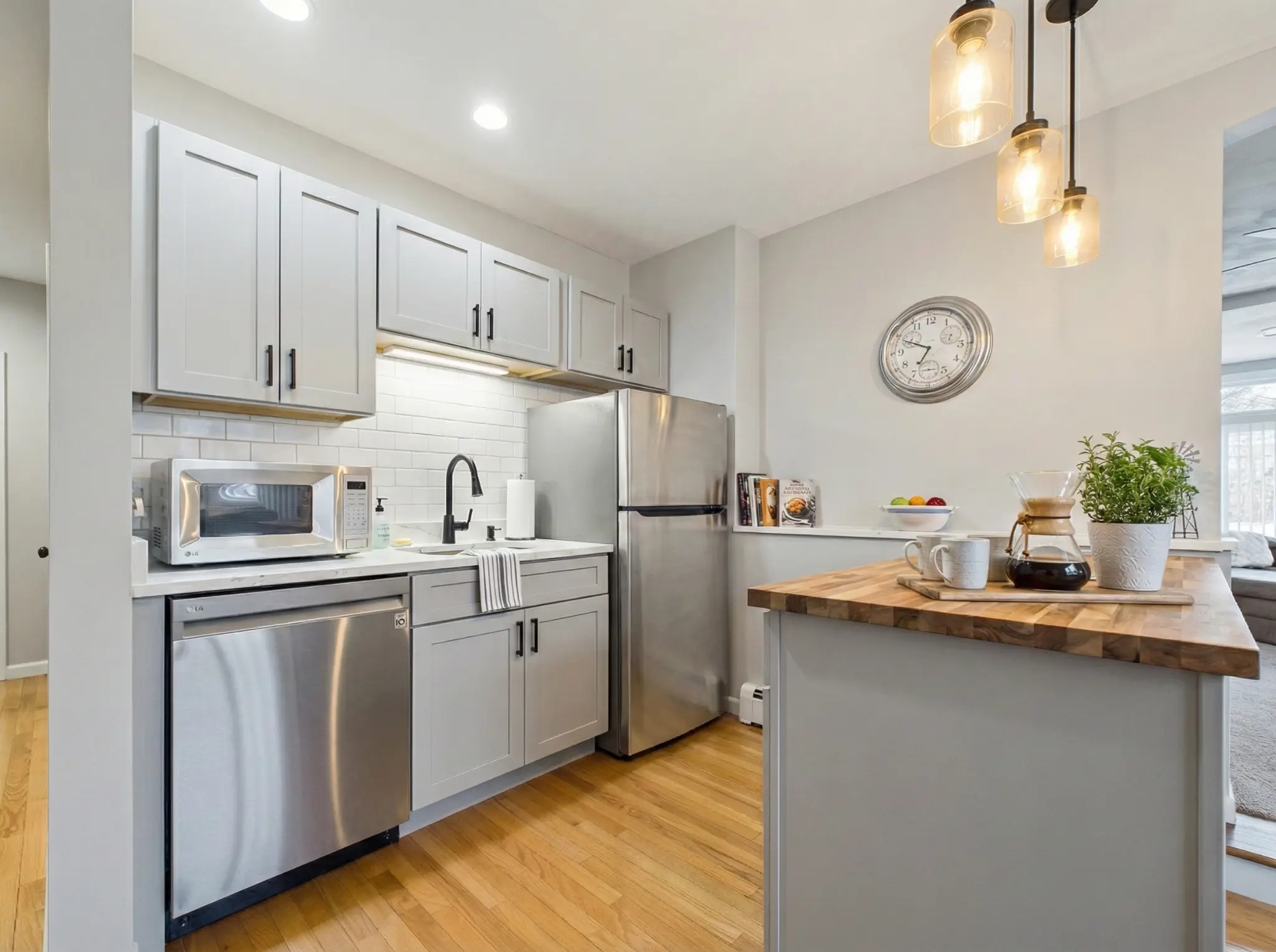 Kitchen after AI virtual staging with modern white cabinets and updated finishes